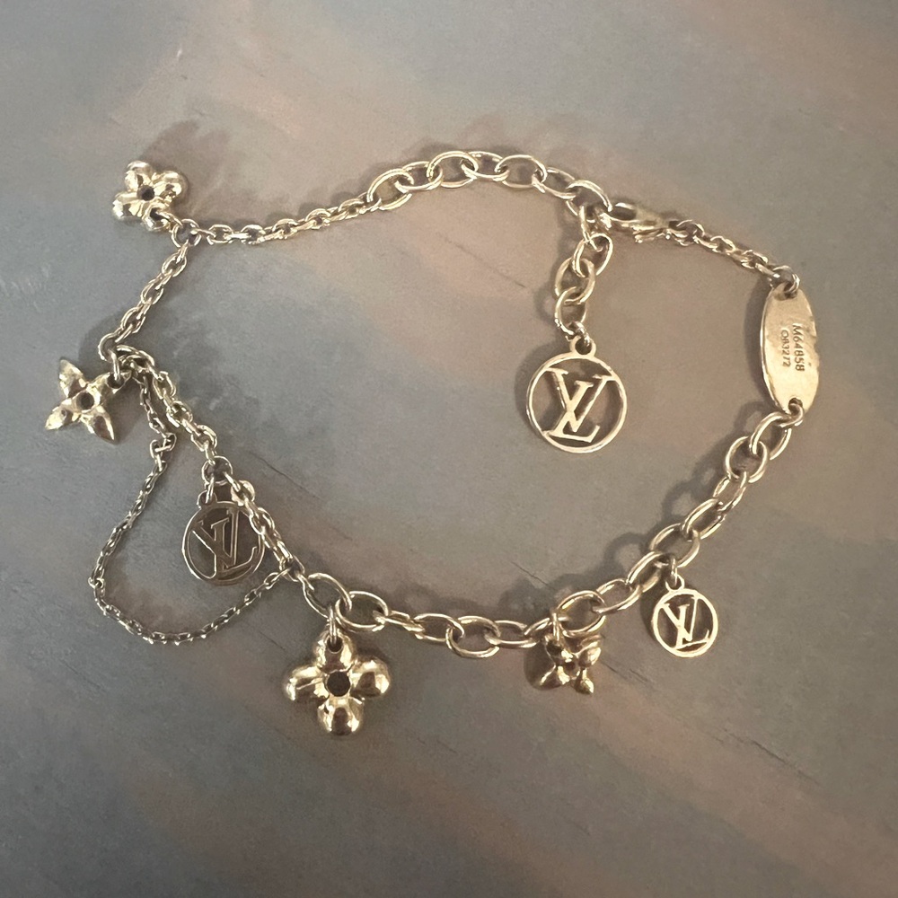 SOLD SOLD Louis Vuitton Supple Bloom gold charm bracelet